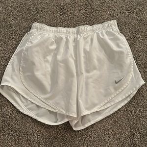white Nike running shorts